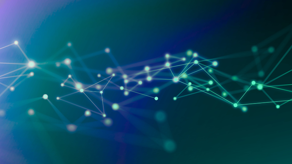 The picture of glowing blue and green connections on a dark background.