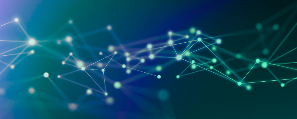 The picture of glowing blue and green connections on a dark background.